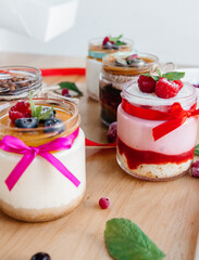 beautifully decorated panna cotta on the table with scattered fruits and decorations