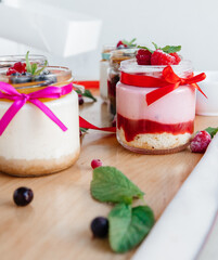 beautifully decorated panna cotta on the table with scattered fruits and decorations