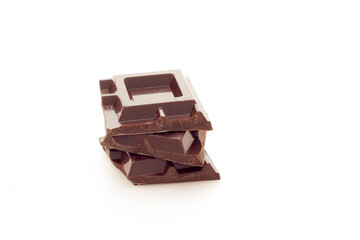 Cubes of dark chocolate white background