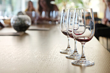 Wine glasses display at winery. Close up, copy space, background.
