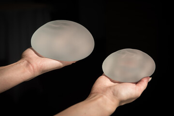 Silicone implant of the female breast during the demonstration of its quality.