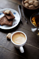 Cup of coffee on rustic wooden background. Close up.	