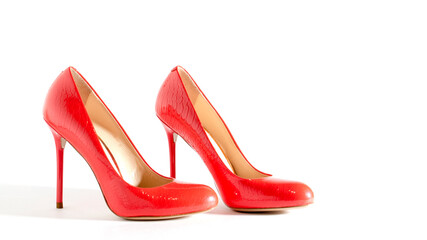 Bright red shoes on the white background. Side view picture. Beautiful high heels shoes. Element...