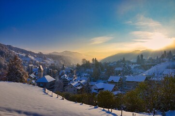 sunrise in the winter landscape, little village Bauma in Zurich Oberland, Switzerland