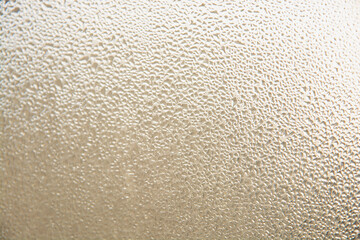 background of water drops or dew on glass in the form of a pattern