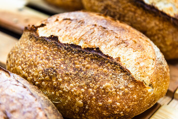 Various rustic bread on a wooden board. Healthy food and farming concept