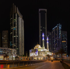 DUBAI, UAE - MARCH 25, 2017: The nightly promenade of Marina and the mosque.