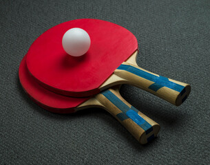 table tennis rackets on dark background
