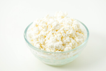 A glass bowl with cotton cheese