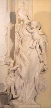 RAVENNA, ITALY - JANUARY 28, 2020: The statue cardinal virtue Charity of in the church Chiesa di Santa Maria Maggiore.