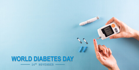 World diabetes day awareness concept. The diabetic measures the level of glucose in the blood, 14...