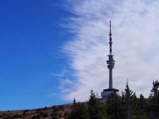 Fototapeta premium transmitter tower on Praděd with beautiful blue and white sky on an autumn sunny day, Jeseníky Mountains, Czech Republic, travel