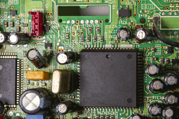 tv chip and other electrical components on circuit board,macro close up