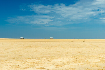 Trucks driving across the desert.