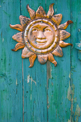 decoration of sun on a wood door