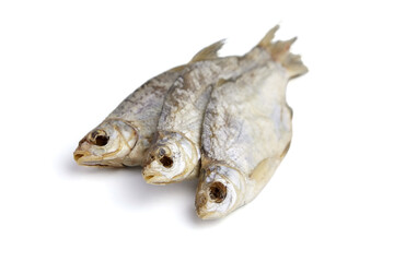 Three dry fish isolated on white background.