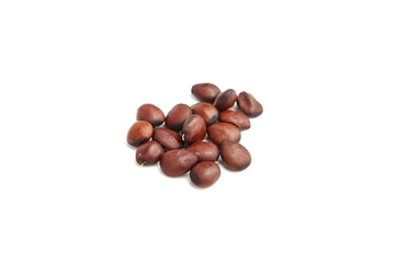 Carob seeds isolated on white background.