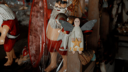 Christmas wooden colourise toys of angel hanging in the house