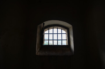 Metal bars in jail. Medieval prison with iron bars. Security grids in Dungeon. Prisoner view. Rods on a locked gate in castle. Barred doors in dungeon. Security grille as protection
