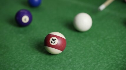 Pool ball with number 15 over green background. High quality photo