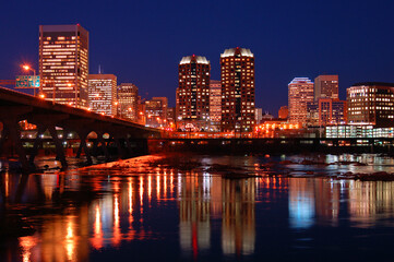 The skyline of Richmond, Virginia is reflected in the James River
