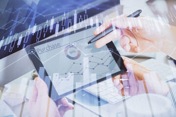 Double exposure of man's hands holding and using a phone and financial chart drawing. Market analysis concept.