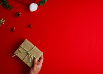 Flat lay Creative composition of Man holding Christmas gift box