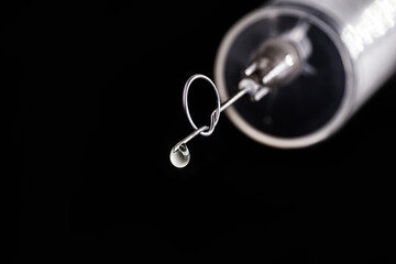 syringe or medical injection with crooked needle, knot, conceptual image, anti vaccine movement,...
