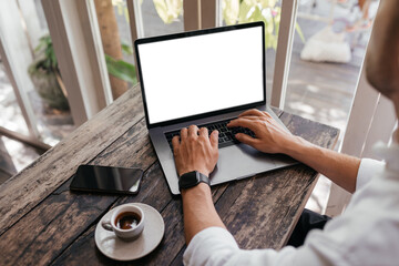 Cropped view of man with laptop computer th copy space for your text or promotional content, mobile...