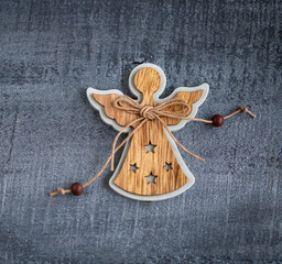 Christmas decorations wooden angel on wooden background