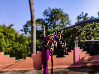 This is the close-up shot of the Clothes drying clip in the winter morning in india.