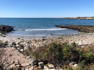 A beautiful rocky beach at the end of the Cliff Walk in Newport RI on a sunny autumn day.