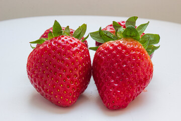 A group of strawberries on a white background