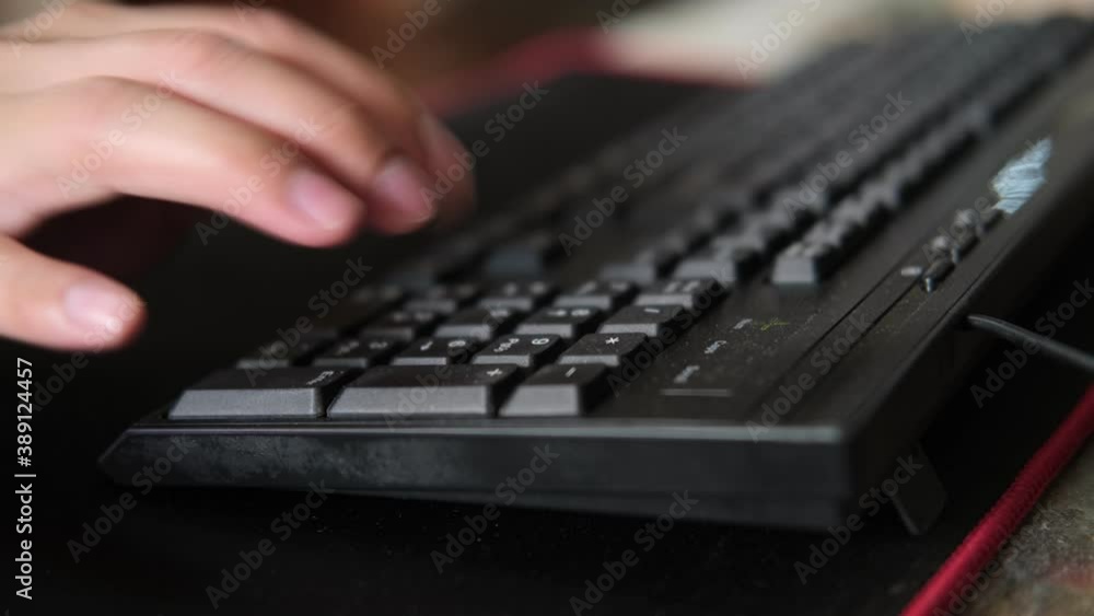 Poster man hand push the black keyboard number keys