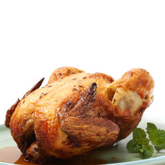 Whole roasted chicken against white background