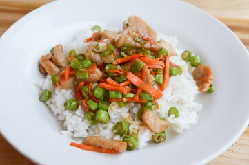 pork and vegetable fried on hot rice - Thailand healthy food