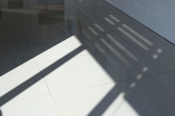 White empty room floor with window shadow.