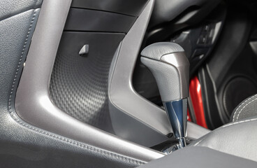 Gray Automatic Gear Handle in Car Interior on Right Frame with Front Seat