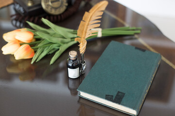 Ready for writing old style set with a feather pen with ink.