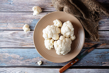 Fresh raw cauliflower in a white bowl