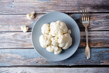 Fresh raw cauliflower in a white bowl