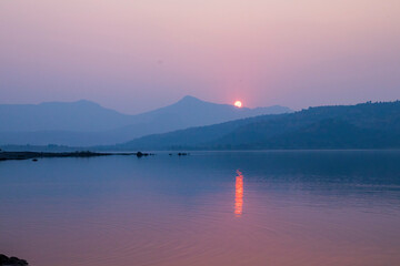 Fototapeta na wymiar Pawana Lake during sunset/sunrise, Lonavla
