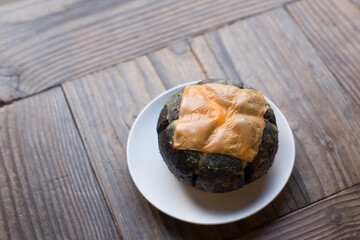 Korean round garlic Bread on the floor.