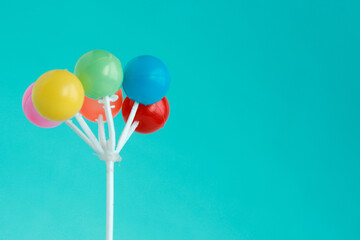 Colorful plastic balloon isolated on blue with copyspace 