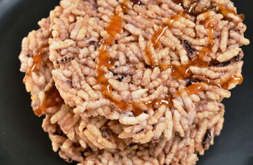 Thai sweet dessert crispy rice cracker with sugar cane baking watermelon juice dressing caramel on plate