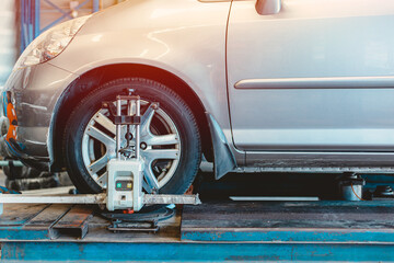 Car tire steering wheel balancing calibrate device for center adjust after tyre replace at garage.