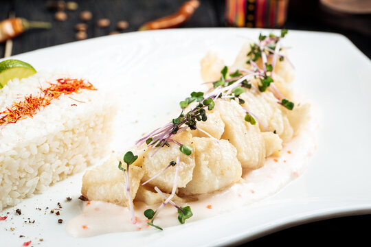 Closeup On Cooked White Fish Fillet With Rice