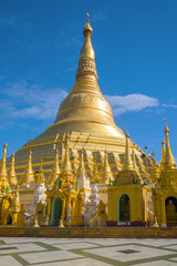 Fototapeta premium Sacred Shwedagon stupa against the blue sky. Yangon, Myanmar