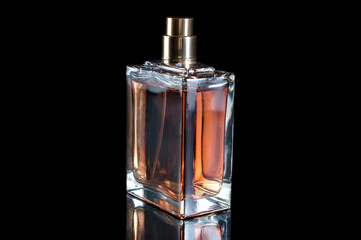Bottle with perfume on black background.