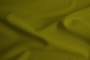 Abstract yellow rippled clothes background .